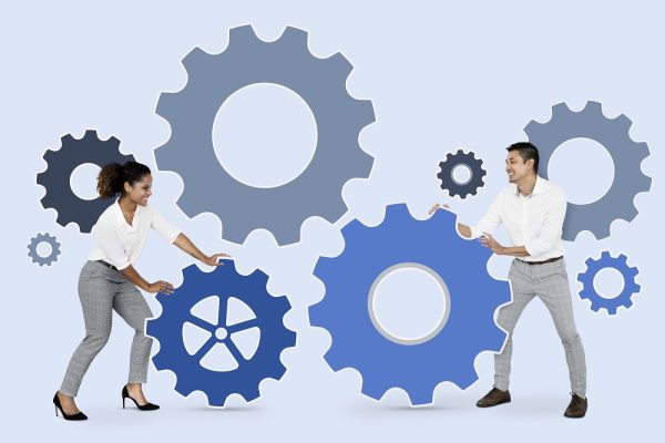 Business people connecting with gears